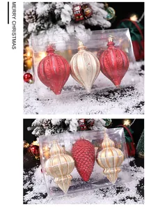 Weihnachtsschmuck-Set mit roten und goldenen Glitzerkugeln in transparenter Box.