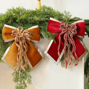 Large velvet Christmas bows in red and gold with glitter ribbon for festive tree decor