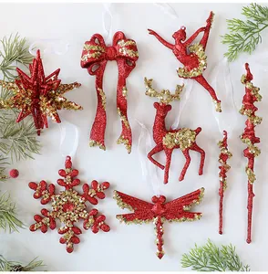 Detailed view of red Christmas ornaments with gold sequins featuring deer and snowflake shapes.