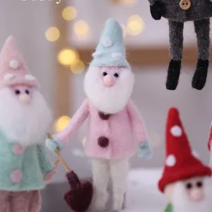 Handcrafted wool felt Christmas gnomes for festive home and office desktop decoration