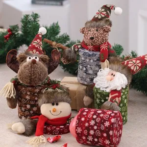 Festive Christmas candy gift boxes featuring cute reindeer and snowman plush designs