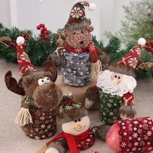 Festive Christmas candy jars featuring Santa, reindeer, and snowman plush designs