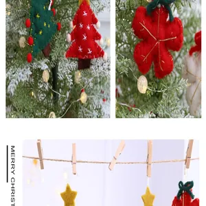 Close-up of handmade felt Christmas ornaments on a tree and hanging from a rope