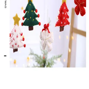 Close-up view of colorful handmade felt Christmas tree and snowflake hanging ornaments
