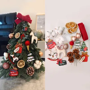 Complete set of mini Christmas tree decorations featuring felt ornaments and pine cones.
