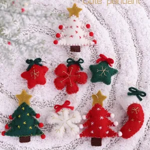 Collection of handmade felt Christmas ornaments featuring trees, snowflakes and stars