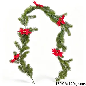 Detailed view of a 180cm artificial Christmas pine garland with red poinsettia flowers