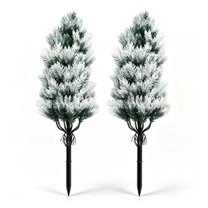Two frosted Christmas pine needle garden stakes with snowy effect for outdoor decoration