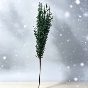 Single realistic artificial pine branch for Christmas home and festive outdoor decor