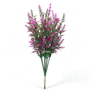 Detailed view of magenta artificial lavender flower bouquet with realistic green plastic leaves