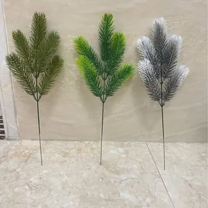 Artificial frosted pine branches for Christmas home decor and DIY floral crafts