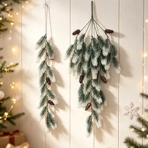 Artificial pine needle teardrop swags with snow flocking and pinecones Christmas decor
