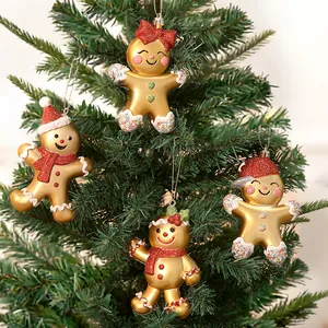 Set of four gold electroplated plastic gingerbread man ornaments for Christmas tree decor