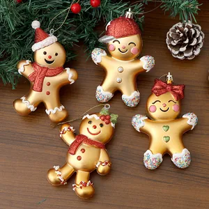 Set of four golden electroplated gingerbread man Christmas tree hanging ornaments.