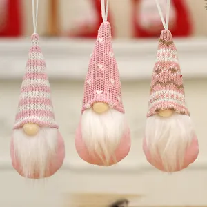 Set of three pink knitted Christmas gnome ornaments for home and tree decoration.