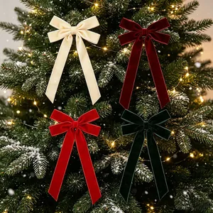 Elegant set of 4 large velvet Christmas tree bows in assorted festive colors for holiday decor.