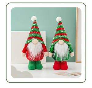 Detailed view of standing Christmas gnomes with sparkling sequins and long white beards