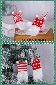 Detailed macro view of handmade knitted Christmas gnome ornaments hanging on a tree