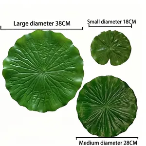 Set of three artificial green lotus leaves in three sizes for party and table decoration.