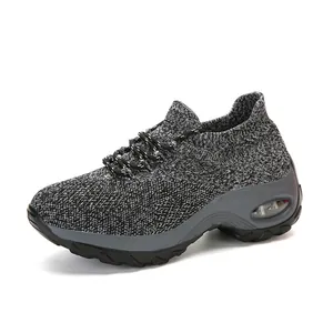 Detailed side view of women's breathable knitted air cushion rocker shoes in gray and black