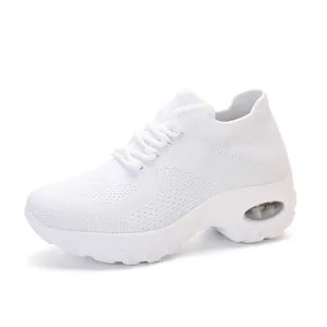 Detailed side view of white women's fly-knit air cushion platform sneakers.