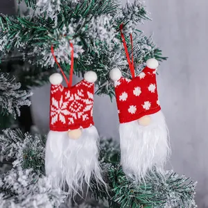 Festive Christmas tree gnome ornaments with red knitted hats and long white fur beards