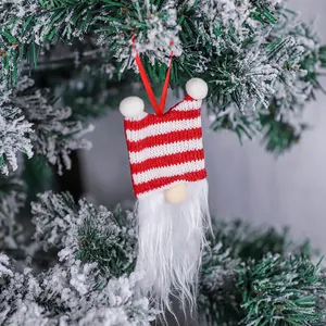 Decorative Christmas tree ornament featuring a red and white striped gnome with a long beard