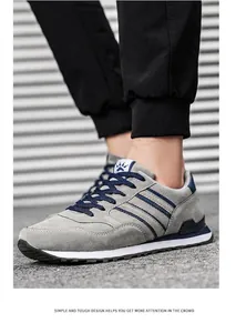 Detail view of grey and blue men's breathable sports sneakers for outdoor casual running