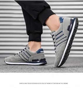 Detailed close-up view of gray and blue men's breathable sports sneakers for outdoor running