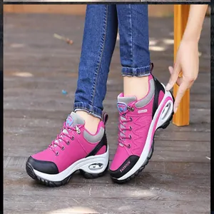 Comfortable women's fuchsia outdoor hiking sneakers featuring a visible air cushion sole