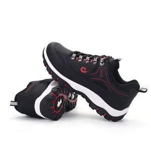Black waterproof non-slip hiking shoes for men with red accents and rugged sole