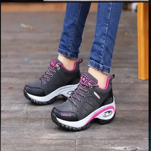 Close-up of women's hiking sneakers featuring pink accents and air cushion soles