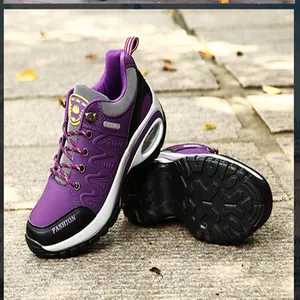 Purple outdoor hiking shoes featuring durable rubber sole and comfortable air cushion