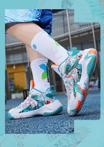 Detailed side view of vibrant graffiti pattern basketball shoes for men and youth
