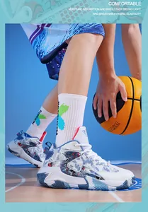 Detailed action shot of white and blue patterned basketball shoes on a court floor