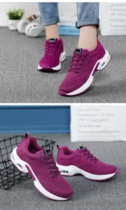 Detailed view of breathable purple mesh sneakers for women featuring a white air cushion sole
