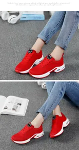Close-up of stylish red breathable mesh sneakers with white air cushion sole for women