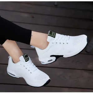 Stylish white mesh women's running sneakers with breathable air cushion sole shown being worn