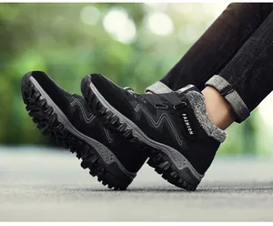 Close-up detail of black outdoor winter shoes featuring cozy grey faux fur lining.