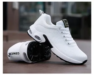 Detailed side view of white women's breathable running sneakers with black accents