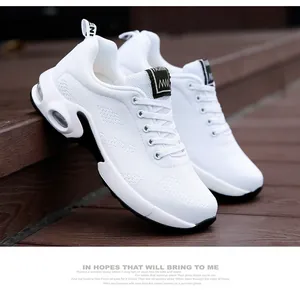 Detailed view of white breathable mesh running sneakers for women with air cushion