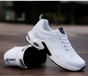 Close-up of women's white mesh running sneakers featuring visible air cushions and black accents