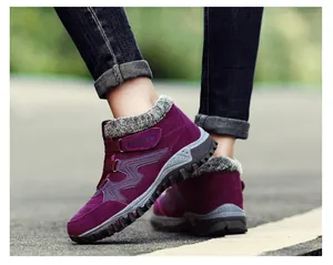 Detail view of purple winter outdoor boots with warm fur lining and non-slip sole.