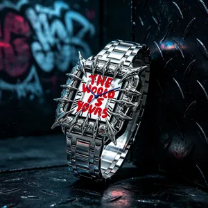 Detail of silver thorn bezel quartz watch with red "The World Is Yours" graffiti dial.