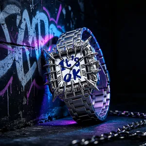 Detailed view of punk silver thorn bezel on a square quartz watch with IT'S OK dial