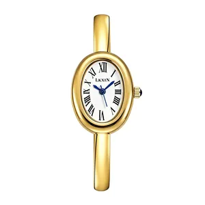 Elegant gold oval bangle watch for women featuring a classic Roman numeral white dial