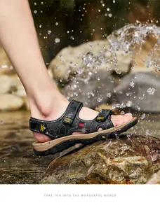Action shot of men's leather sports sandals stepping on wet rocks with water splashes