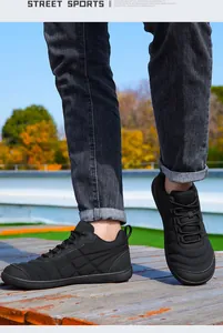 Vista detallada de zapatillas casuales negras de talla grande antideslizantes para hombre