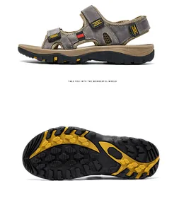 Detailed side view and non-slip rubber sole pattern of grey men's leather beach sandals