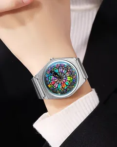 Detailed view of a silver quartz watch featuring a unique stained glass eye pattern dial
